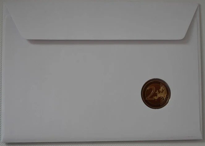 Carta numismática con moneda de fondo espejo